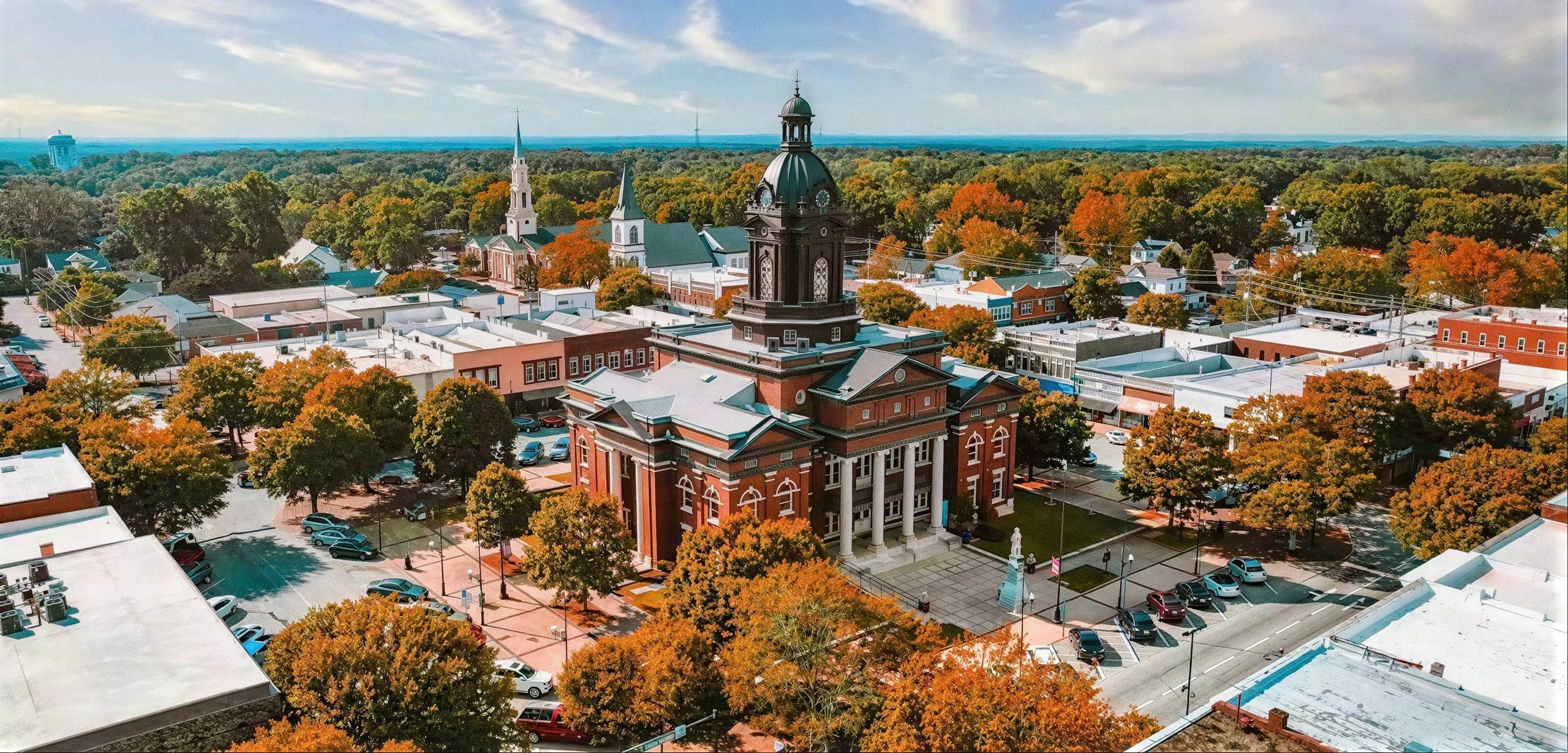 Aerial view of the Coweta County Courthouse and historic downtown Newnan, GA in the fall